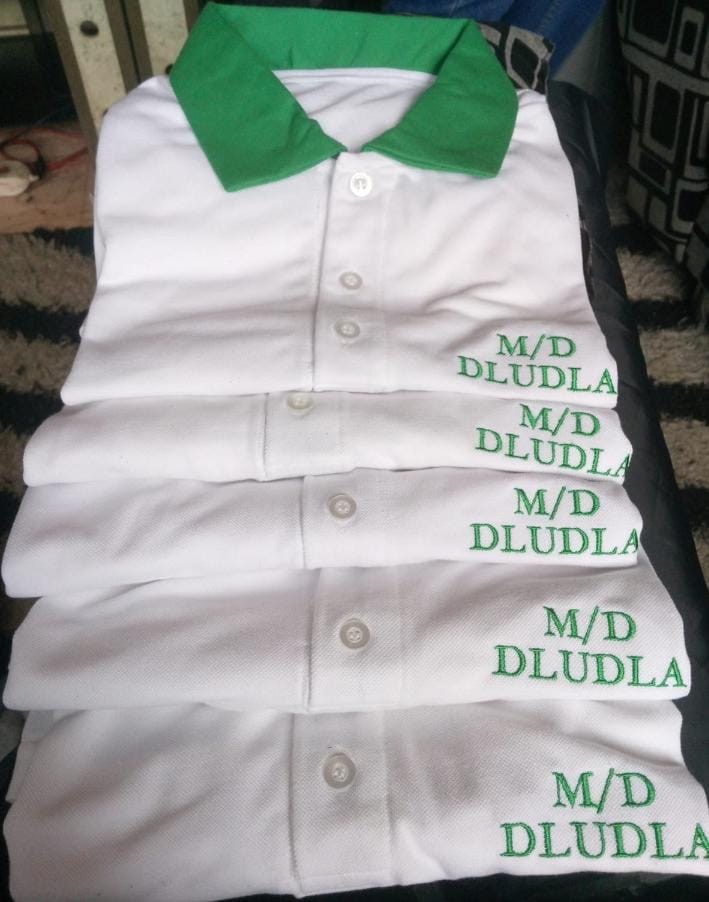White golf shirts with M/D Dludla embroidery